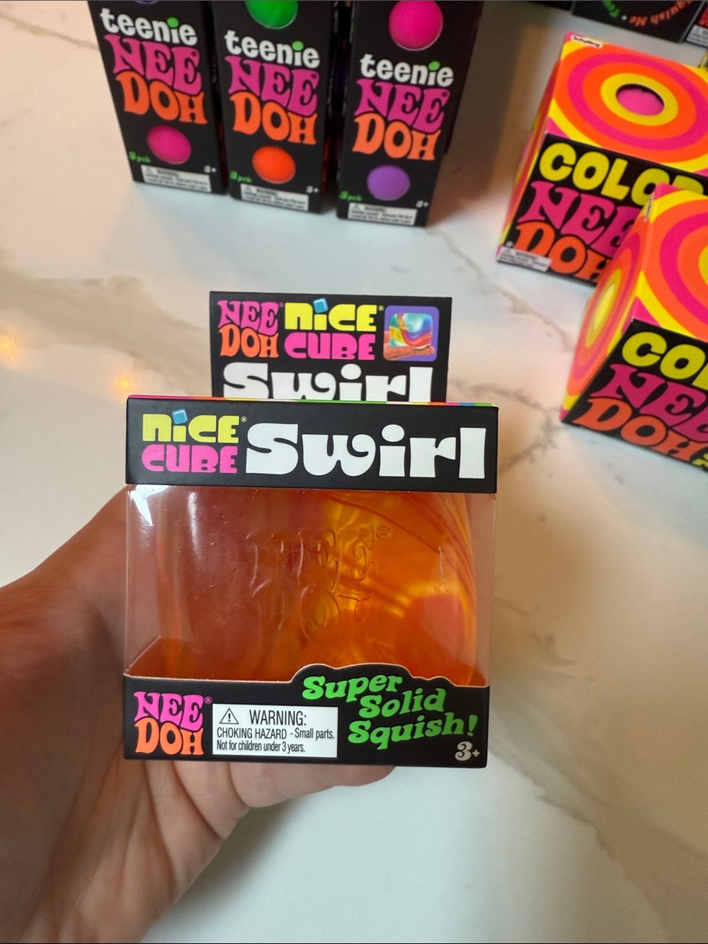 NeeDoh Nice Cube Swirl - Orange Clear Squish Toy